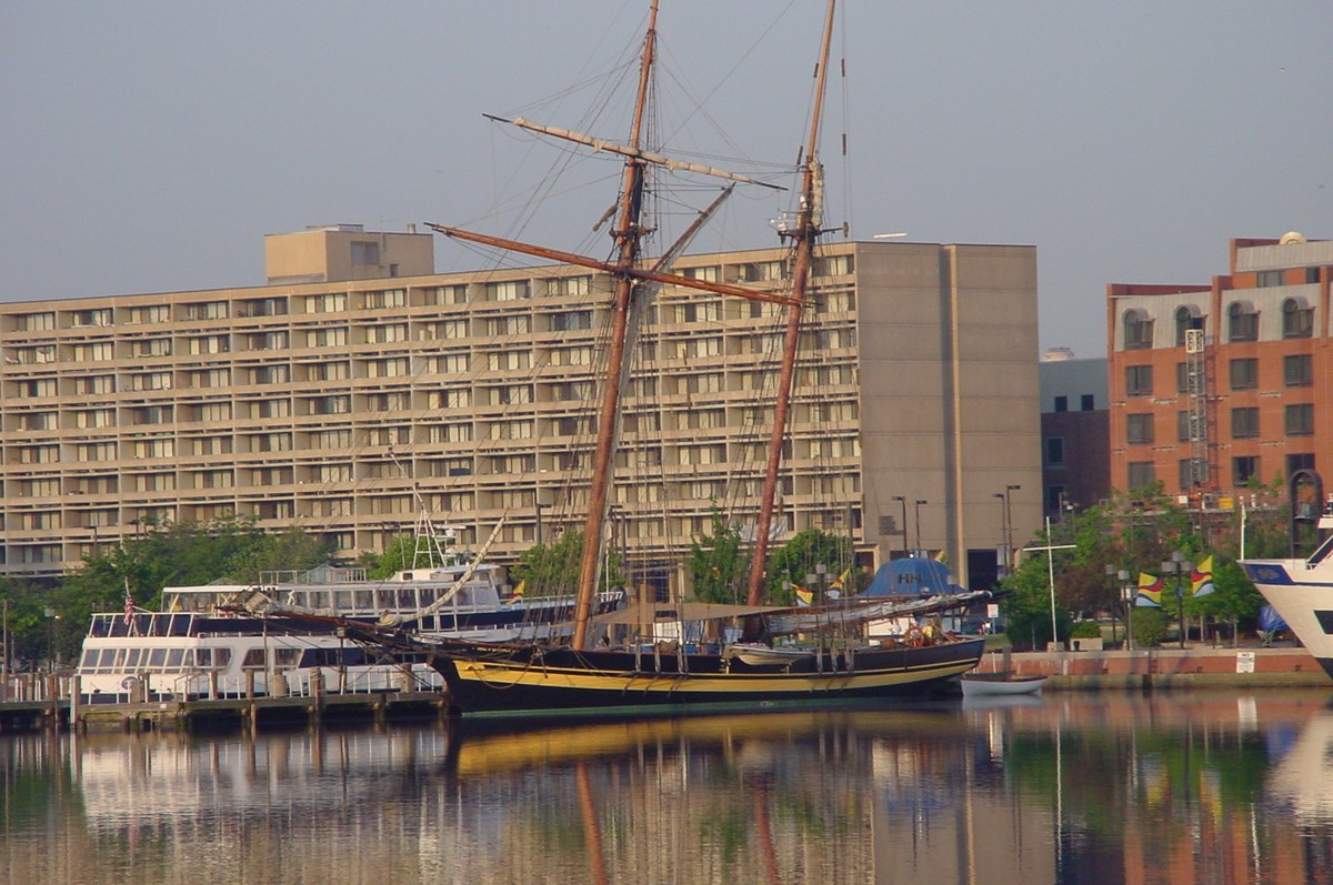 A topsail schooner across the water